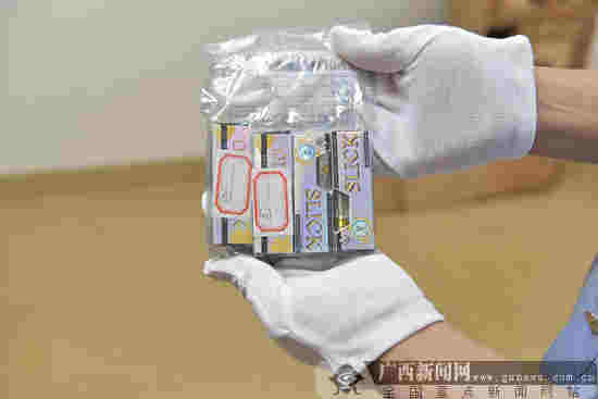 桂林市首例邮包走私大麻烟油案开庭审理